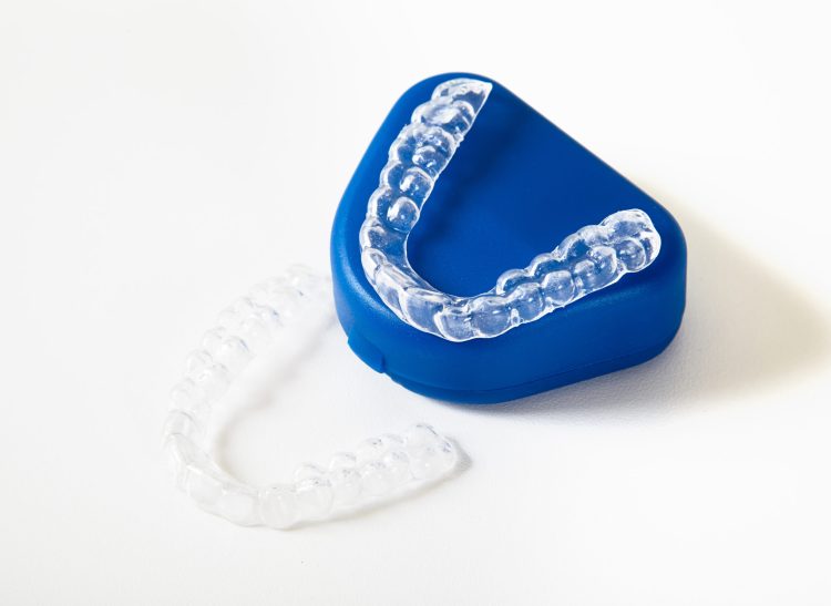 two dental whitening trays and a box for it